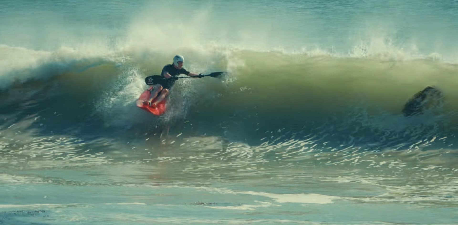 A warrior driving through the pocket on a red waveski