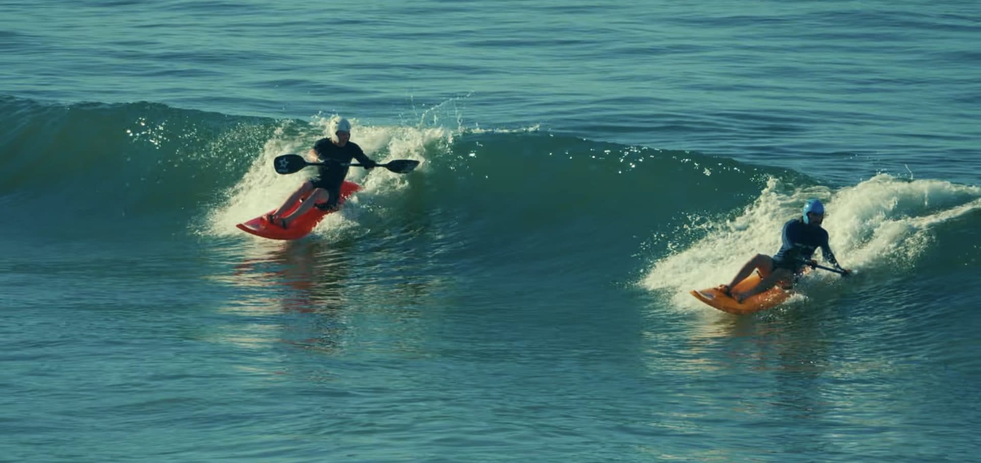 Two warriors riding the same wave together